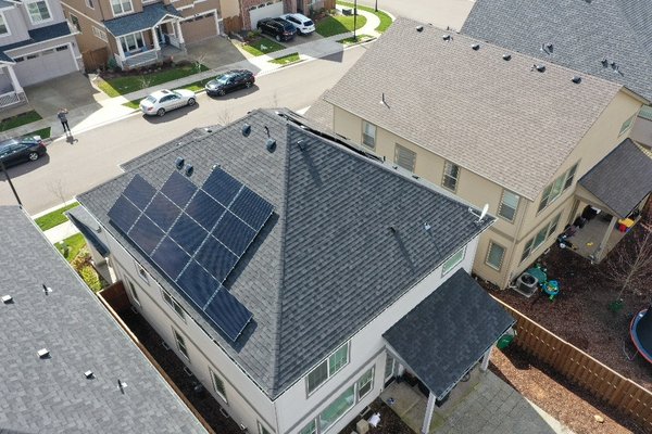 Aerial view of completed solar panel install on suburban home