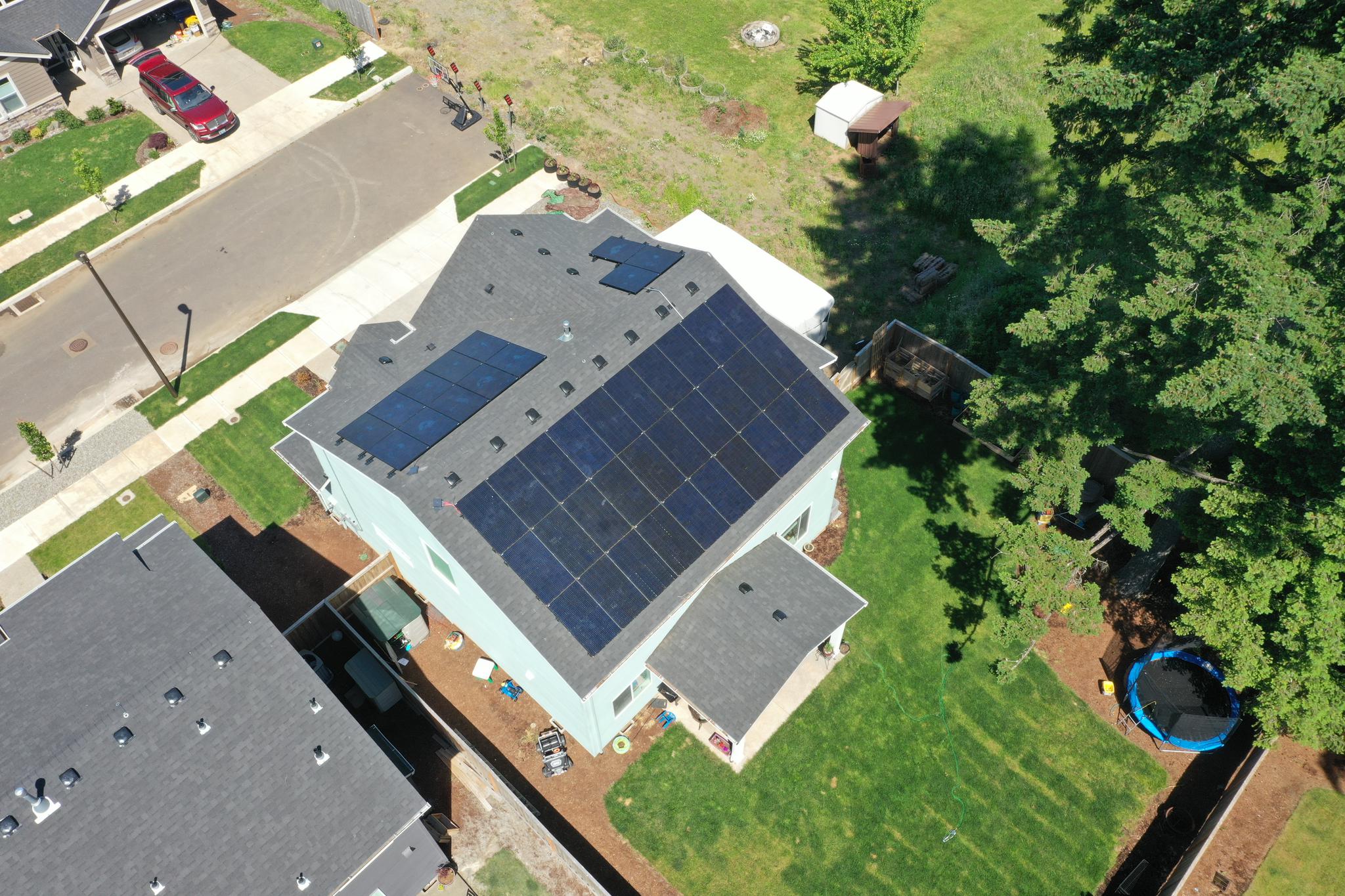 Drone shot of large rooftop solar array installed by Infinity Solar